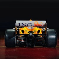 a picture of a racing car in a dark room