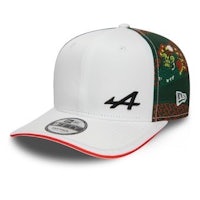 a white and green hat with the number 4 on it